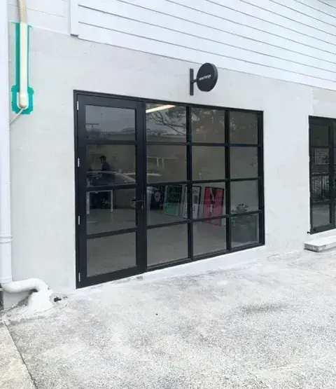 Black aluminium glazed shopfront for an Auckland commercial building